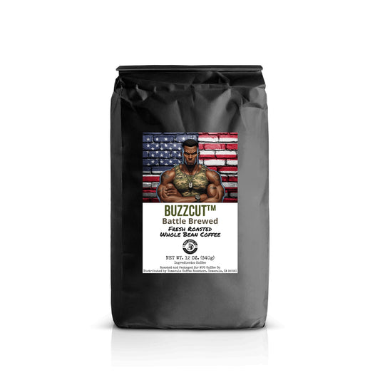 Black coffee bag with Buzzcut™ character crossing arms in front of an American flag brick wall. Label reads: “Buzzcut™ – Battle Brewed – Fresh Roasted Whole Bean Coffee.”