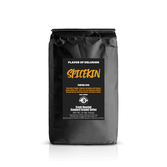Black standard ground coffee 12 oz bag with 'Spicekin' Pumpkin Spice flavored coffee from MUG Coffee Co on a black background