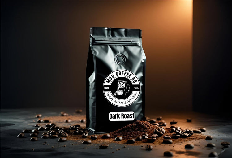 Matte black coffee bag with “Dark Roast” label at the bottom and MUG Coffee Co logo in the center. Surrounded by rich, oily beans and dark grounds, emphasizing the bold, intense flavor of the roast.